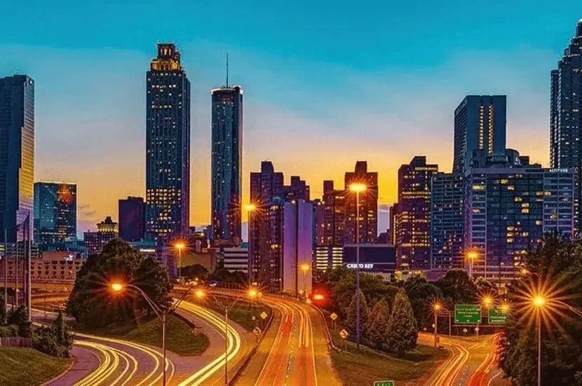 A painting of the city skyline at dusk.