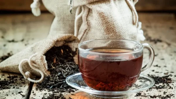 A cup of tea sitting on top of a saucer.