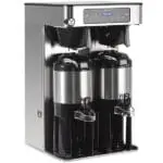 A Bunn ICB Twin Tall Infusion Series Cafeteria and Coffee Shop Coffee Brewer with digital display and two mounted black thermal coffee pots.