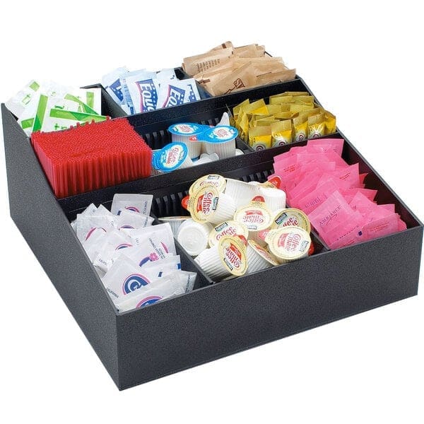 A Cal-Mil Adjustable Black Coffee Condiment Organizer filled with various packets of sugar, artificial sweeteners, stirrers, and small creamer containers.