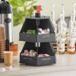 Black condiment dispenser with four compartments.