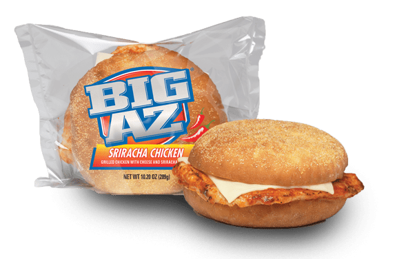 A BIG AZ Sriracha Grilled Chicken Sandwich in a clear package, featuring a chicken patty with cheese and sauce on a bun.