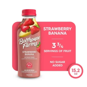 Bottle of Bolthouse Farms Fruit Juice Smoothie, Strawberry Banana against a pink background, highlighting no sugar added and 3 3/4 servings of fruit, 15.2 oz size.