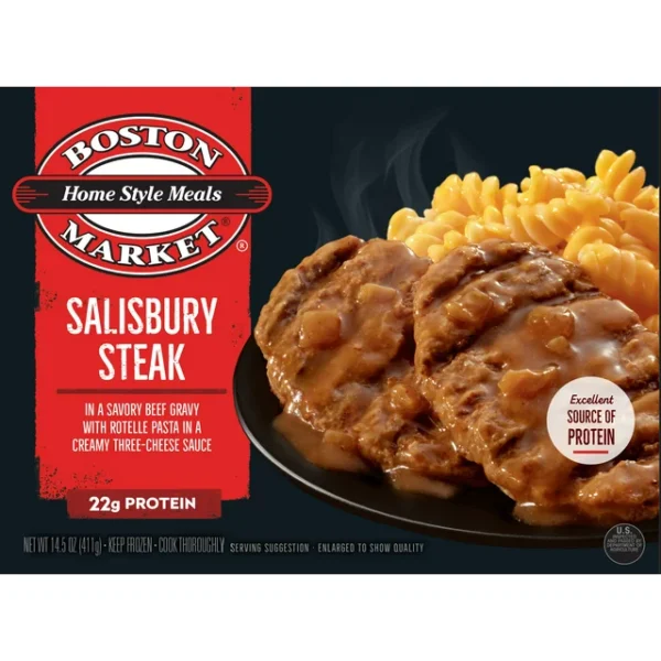 Packaged Boston Market Salisbury Steak Meal with macaroni and cheese on a dark background, labeled as "home style meals market," highlighting 22g of protein.