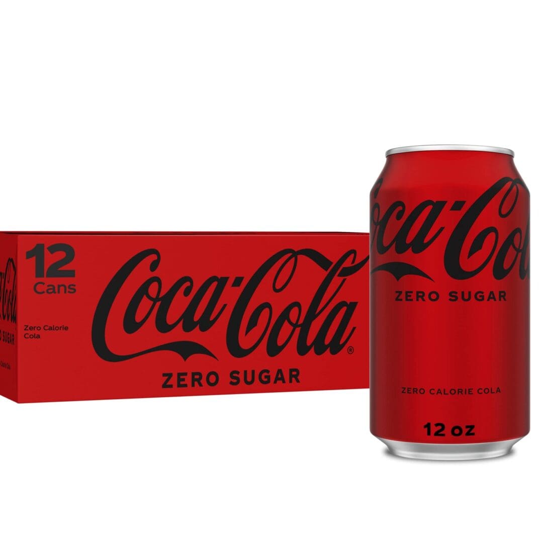 A red Coca-Cola Zero Sugar Soda Can next to a box labeled "12 cans of Coca-Cola Zero Sugar Zero Calorie Cola.