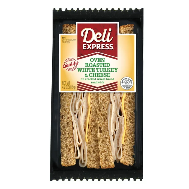 Deli Express Oven Roasted White Turkey and Cheese Wedge sandwich on cracked wheat bread, visible in clear plastic wrapping.