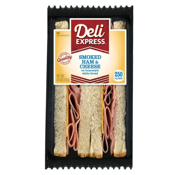 Packaged Deli Express Smoked Ham and Cheese Wedge on white bread in clear plastic container.