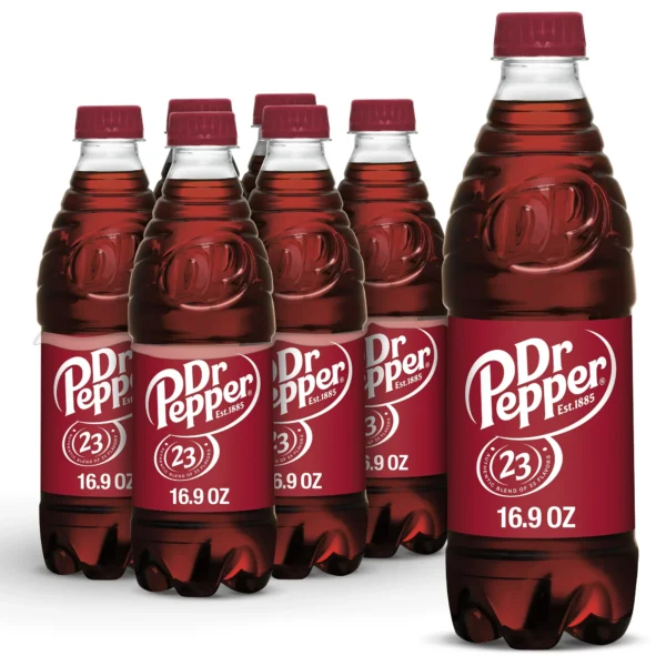 Six bottles of Dr Pepper Soda Bottles with red labels, lined up on a white background. each bottle holds 16.9 ounces of soda.