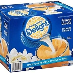 Box of International Delight French Vanilla Creamer Singles, showcasing 192 individual portions with images of coffee and vanilla flowers.