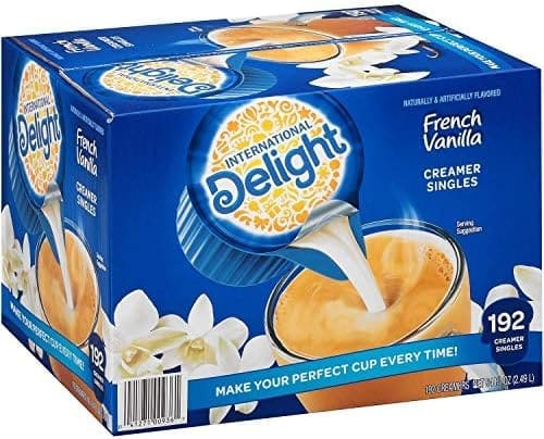 Box of International Delight French Vanilla Creamer Singles, showcasing 192 individual portions with images of coffee and vanilla flowers.