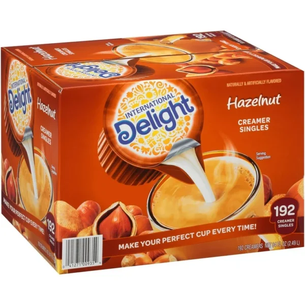 A box of International Delight Hazelnut Coffee Creamer Singles, indicating 192 single-serve packets.