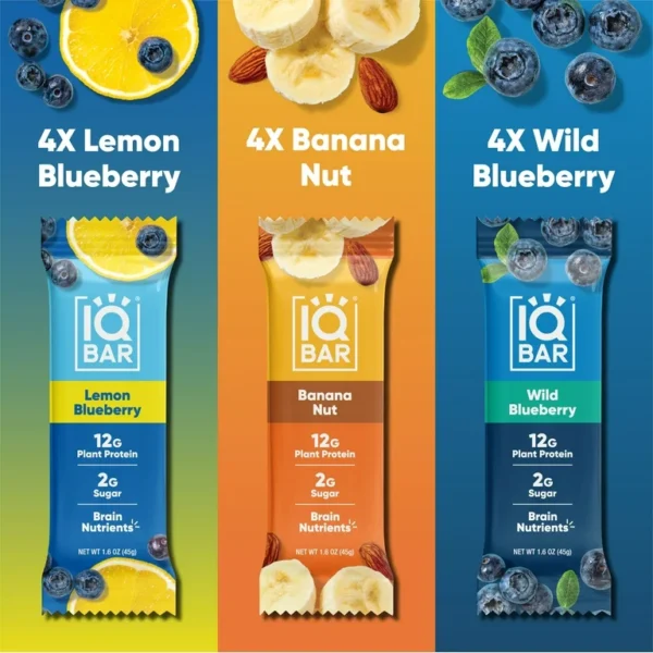 Three IQBAR Brain & Body Fruit Lovers Variety Keto Protein Bar packages—lemon blueberry, banana nut, and wild blueberry—with ingredient highlights and scattered slices of lemon, banana, and blueberries around each.