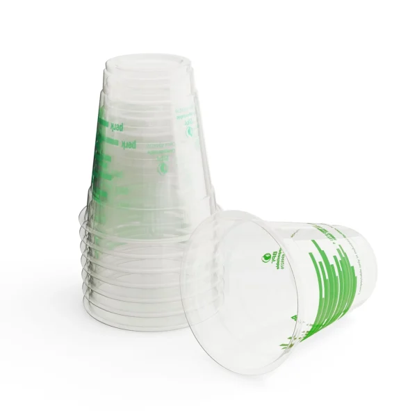 Stack of clear plastic cups with green markings.