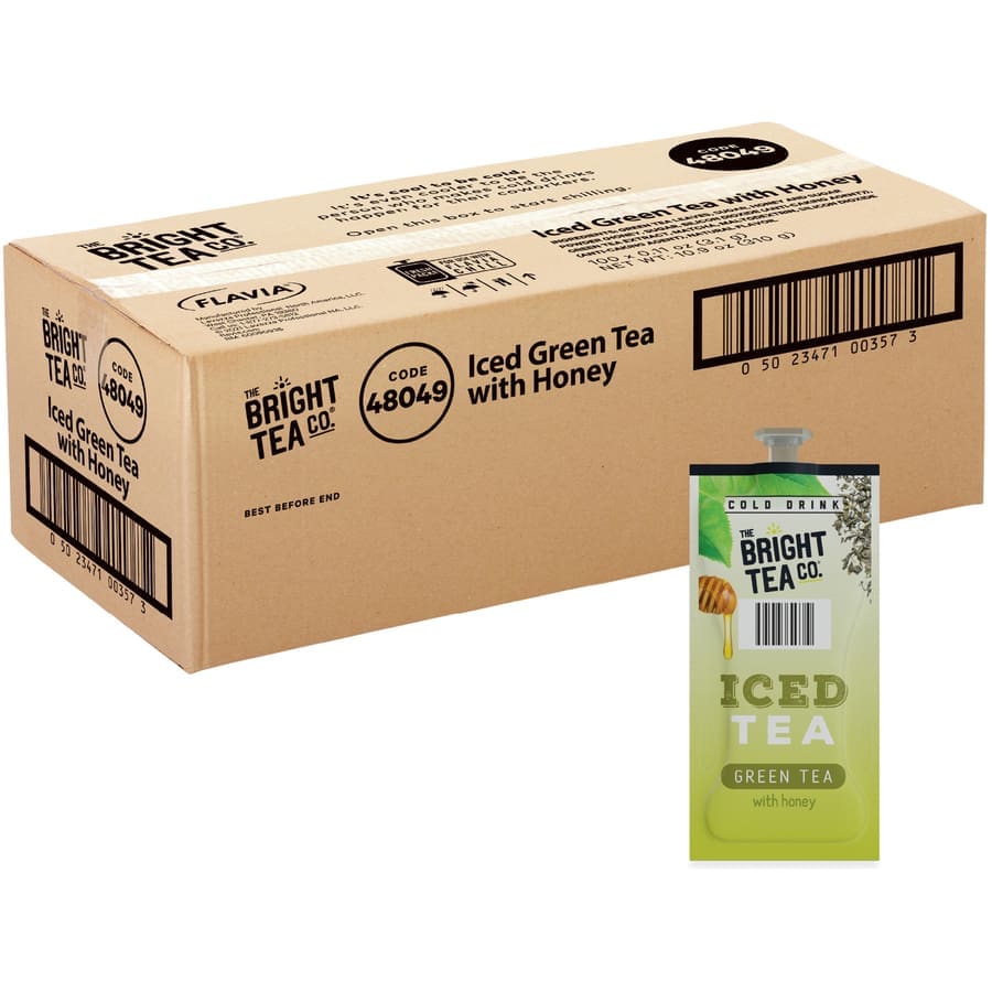 A cardboard box labeled "FLAVIA The Bright Tea Co. Green Tea, Flavia Freshpack iced green tea with honey" next to a carton of the same tea against a white background.