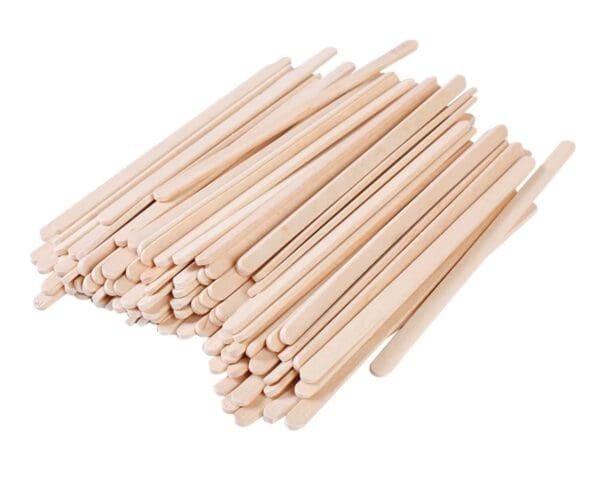 A pile of Berkley Square Stirrer 5.5" Coffee Wood arranged neatly on a white background.